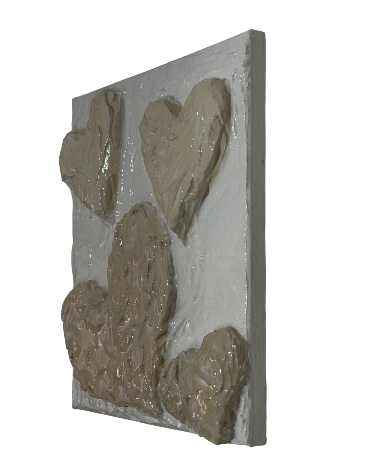 Bianco Terra CUORE No. 01 3D heart wall art with textured buttercream plaster in alabaster and nude tones.