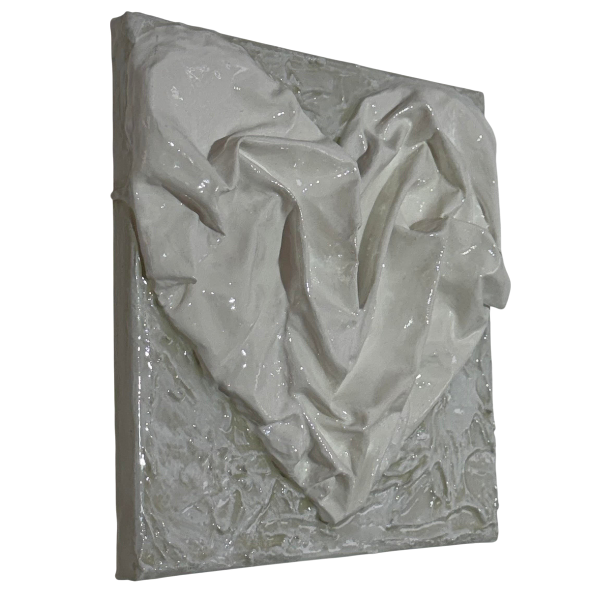 Bianco Terra AFFETTO No. 04 textile heart wall art with white fabric folds on a distressed plaster background.
