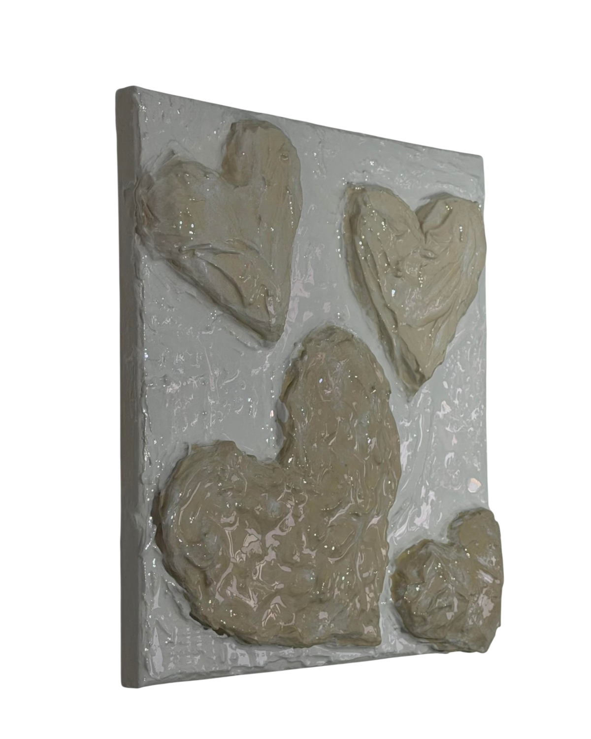Bianco Terra CUORE No. 01 wall art featuring hand-sculpted 3D hearts in textured alabaster and chalk plaster finish.