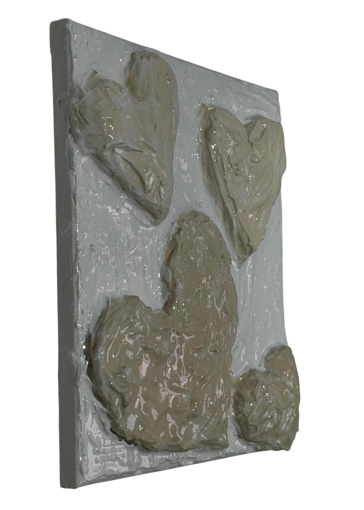Bianco Terra CUORE No. 01 textured plaster wall art featuring multiple 3D sculpted hearts in alabaster and nude tones.