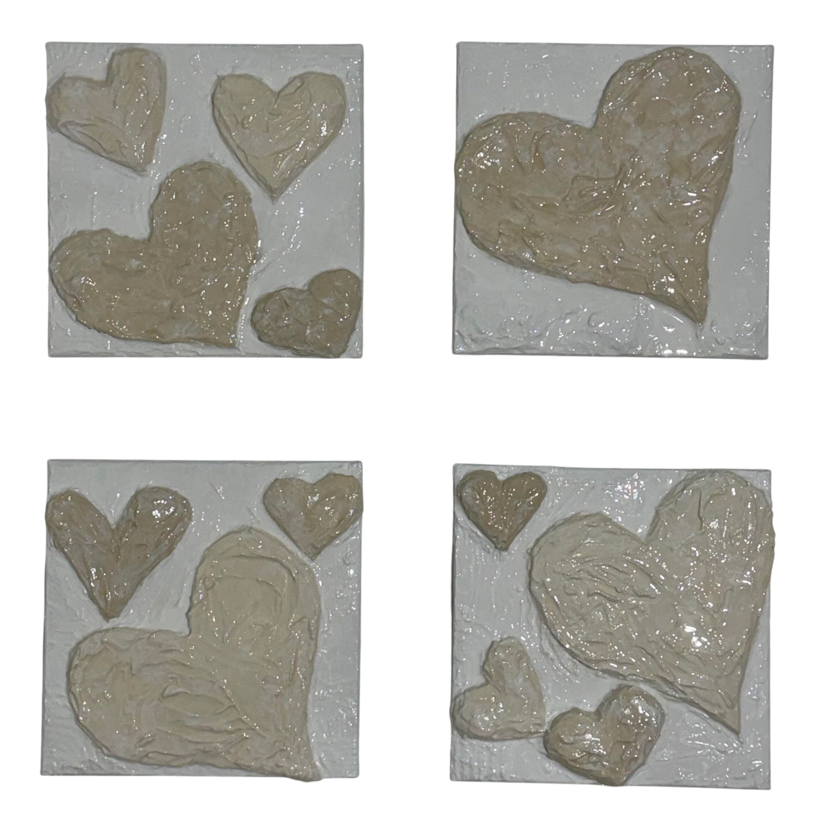 Bianco Terra CUORE No. 04 set of four square canvases featuring hand-sculpted 3D plaster hearts in alabaster and nude.