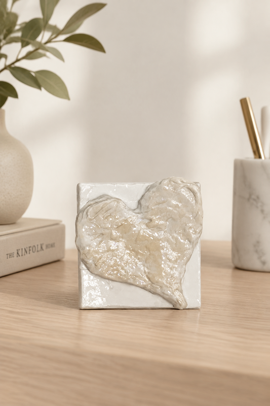 Bianco Terra Cuore Mini No. 02 miniature heart sculpture with textured buttercream plaster on a square canvas.