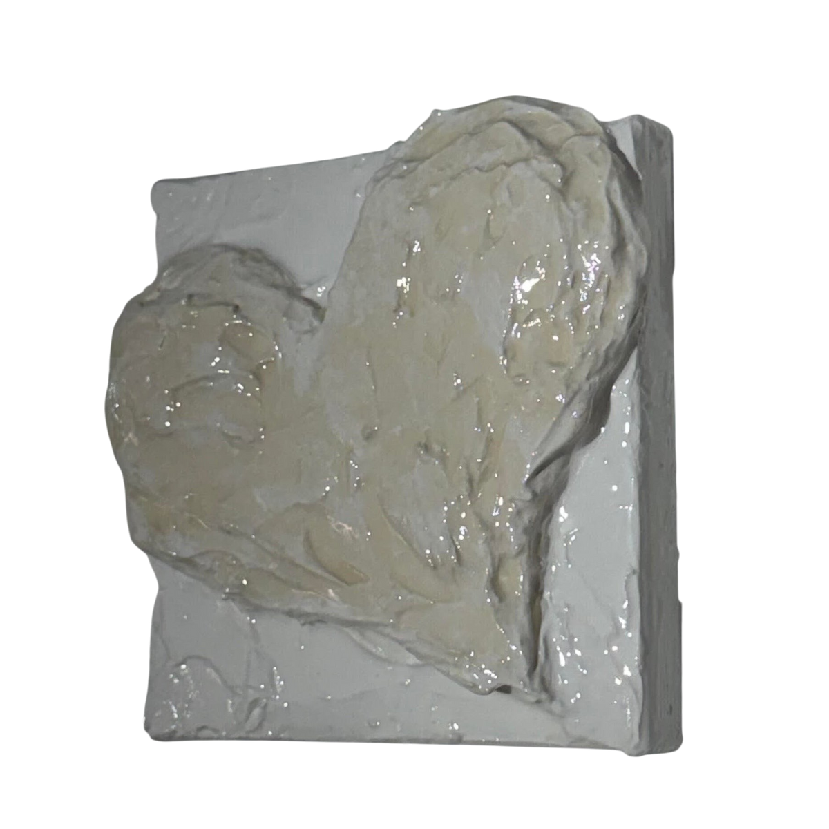 Bianco Terra CUORE MINI No. 03 heart sculpture with textured buttercream plaster and glossy resin finish on canvas.